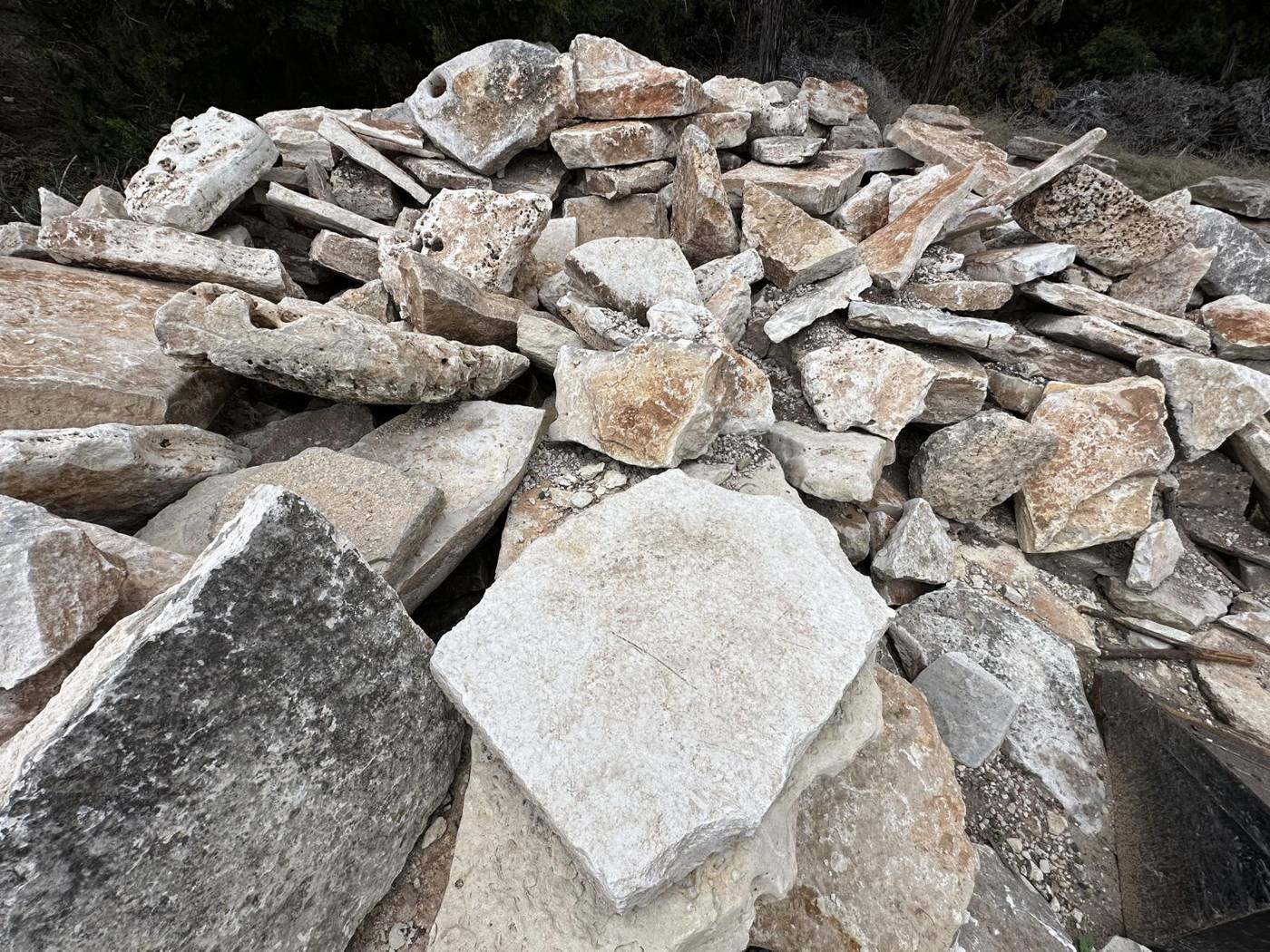 Pile of natural flagstone ready for selection at the stone yard